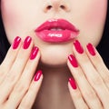 Makeup Lips with Pink Glossy Lipstick and Pink Nails Royalty Free Stock Photo