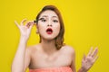 Makeup mascara. Funny image of beautiful trendy young asian fema Royalty Free Stock Photo