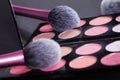 Makeup palette and brush reflect in mirror. Royalty Free Stock Photo