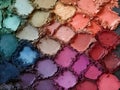a makeup palette with different colored eyeshadow, a diverse and artistic view of cosmetic beauty items Royalty Free Stock Photo