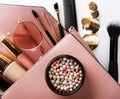 Makeup products with cosmetic bag on white background Royalty Free Stock Photo