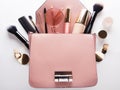 Makeup products with cosmetic bag on white background Royalty Free Stock Photo