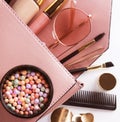 Makeup products with cosmetic bag on white  background Royalty Free Stock Photo