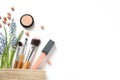 Makeup products and cosmetic bag on white background Royalty Free Stock Photo