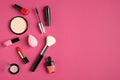 Makeup products and cosmetics on pink background. Flat lay, top view. Beauty and fashion concept Royalty Free Stock Photo