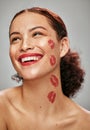 Makeup, red lipstick and kiss on face of woman model in studio for cosmetics, love and happiness. Beauty headshot of