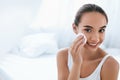 Makeup Remove. Girl Cleaning Face Skin With Cosmetic Pad Royalty Free Stock Photo