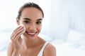 Makeup Remove. Girl Cleaning Face Skin With Cosmetic Pad Royalty Free Stock Photo