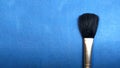 Makeup rush on blue background Royalty Free Stock Photo