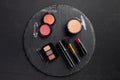 Makeup set with eye shadows and blush on round Royalty Free Stock Photo