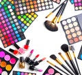 Makeup set palettes with colorful eyeshadows. Cosmetic brushes