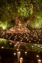 Makha Bucha Day.Traditional buddhist monks are lighting candles for religious ceremonies at Wat Phan Tao temple