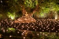 Makha Bucha Day.Traditional buddhist monks are lighting candles for religious ceremonies at Wat Phan Tao temple