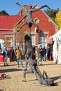 Acrobatic buskers entertaining festival goers at the Village Green at the National Arts Festival Royalty Free Stock Photo