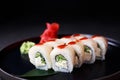 Maki roll with sea perch, served on black plate,