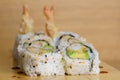 Maki roll with shrimps fried, avocado and lattuce