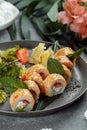 Maki Sushi - a roll of cream cheese, strawberries, avocado and fried salmon. Summer seasonal sushi rolls Royalty Free Stock Photo