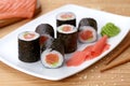 Maki sushi roll with salmon, wasabi, ginger and Royalty Free Stock Photo