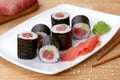Maki sushi roll with tuna, wasabi, ginger and nori