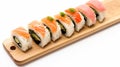 Maki Sushi Rolls set on wooden bamboo board.