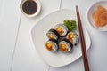 Maki sushi on white plate.Japanese sushi rolls with salmon, cucumber, shrimp eggs and Imitation Crab Stick