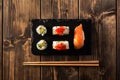 Maki sushi on a wooden table. Top view Royalty Free Stock Photo