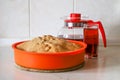 Making apple pie at home. Homemade pastry in silicone cake pan served with cherry fruit drink Royalty Free Stock Photo