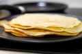 Making bliny at home. Closeup of traditional tasty thin pancakes. Photo with selective focus