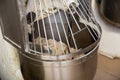 Making bread dough in kneading machine Royalty Free Stock Photo