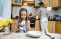 Making breakfest. Little mother's helper