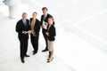 Making business happen. High-angle portrait of a group of businesspeople talking in the lobby. Royalty Free Stock Photo