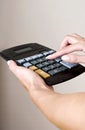 Making calculation with calculator Royalty Free Stock Photo