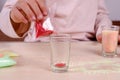 Making candles by yourself . Little girl making candle in the glass from soy wax parsley flakes. Royalty Free Stock Photo