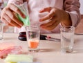 Making candles by yourself . Little girl making candle in the glass from soy wax parsley flakes Royalty Free Stock Photo