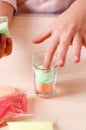 Making candles by yourself . Little girl making candle in the glass from soy wax parsley flakes Royalty Free Stock Photo