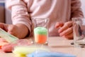 Making candles by yourself . Little girl making candle in the glass from soy wax parsley flakes Royalty Free Stock Photo