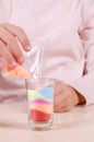 Making candles by yourself . Little girl making candle in the glass from soy wax parsley flakes Royalty Free Stock Photo