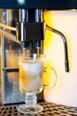 Making capuchino in coffee machine