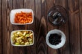 Making carrot applesauce. blender bowl, blackcurrant bowl, and two white bowls of chopped vegetables and fruits Royalty Free Stock Photo