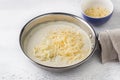 Making cheese sauce for pasta. Add grated cheese and stir. DIY step by step step 8