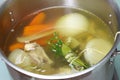 Making chicken bouillon in a pot Royalty Free Stock Photo