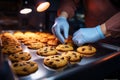 Making chocolate chip cookies with gloved hands, carrying a colorful backpack