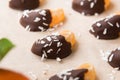 Making chocolate-dipped mandarin slices