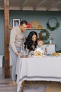 Making Christmas ginger house with family Royalty Free Stock Photo