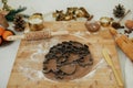 Making christmas gingerbread cookies. Gingerbread dough with festive metal cutters on wooden board with flour, cooking spices, Royalty Free Stock Photo