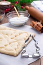 Making Christmas tree shaped puff pastry cookies with sugar and cinnamon, vertical