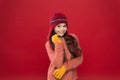 Making christmas wish. Stay warm. Little girl winter fashion accessory. Small child long hair wear hat burgundy Royalty Free Stock Photo