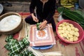 Making Chung cake by female craftsman closeup. Traditional Vietnamese New Year Tet food.