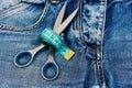 Making clothes and design concept: scissors wound around measure tape Royalty Free Stock Photo