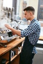 Making Coffee. Barista Using Coffee Machine In Cafe